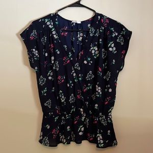 Floral flutter sleeve blouse.